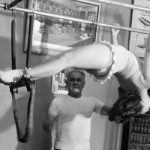 Love Is All Around: Kathy Remembers Romana Kryzanowska It's been almost eight months since the Pilates world, and the world at large, saw a brilliant light fade out in the passage of Romana Kryzanowska. She's admired by Pilates instructors across the globe for her unwavering devotion to the Pilates method, which she studied under Joseph Pilates himself, becoming a champion of the fitness system after his death.Over the course of decades, Romana taught countless clients; at the same time, she mentored and passed the classical Pilates legacy to hundreds of apprentices, many of whom have gone on to become the top Pilates instructors in the world. As the owner of Dynamic Fitness, Sarasota's original Pilates studio, I feel incredibly blessed to be a member of a generation of Pilates instructors who trained and obtained our certification under Romana.I clearly remember that day in 1996 when I first walked into Drago's Gym, the studio where Romana worked tirelessly to preserve the authentic, classical Pilates method. One end of the studio was full of aspiring gymnasts and circus artists who shared the studio, flying around in the air on trapeze swings and parallel bars. The reformers and other equipment originally designed by Joe Pilates stood in the middle of the studio. Where I'd expected a solemn temple to the revered fitness method, I entered an atmosphere of controlled chaos and vibrant energy.Romana was definitely the wellspring of that energy. An abundantly giving instructor, she was like a mother to the apprentices, pushing us hard to become the most competent, knowledgeable, and safety-minded teachers of the system she loved like life itself. Romana's true love of the work and her connection to Joe Pilates was apparent in everything she did.Romana was the embodiment of pure joie de vivre, and she taught us to play hard as well as work hard. When one of us made a big breakthrough, like performing our first teaser on the reformer, Romana would cry, "Caramba! Champagne!" And then the whole studio would toast a glass of sparkling wine.Indeed, there was nothing clinical about the way Romana taught Pilates. Her imagery had nothing to do with anatomy, but more with movement. Romana was a ballerina by training, and it was like she danced with the people she taught. With her intuitive way about teaching and about people, Romana could look at a body in front of her and know the right thing to do with that person. She painted pictures with her cues and helped each student find his or her own way through an exercise. Romana didn't just teach the Pilates method, but she taught her great love for it as well. I believe that's the reason why Pilates is so alive and strong today: Nobody else had the charisma to pass it to the next generation with so much passion. Nobody else could fuel it the way she did. At her memorial service in New York, hundreds of Romana's former students (now instructors) packed inside St. Patrick's Cathedral, some traveling from as far away as Australia to celebrate Romana's life and her memory. The last eulogist ended his commemoration with a question: "What did Romana always say?" Every single person in the church responded instantly: "Love is all around!" we shouted. That was Romana's mantra. You felt it when you were with her, and we certainly felt it at that moment. We are lucky -- the ones who worked with her, she left a little bit of her spirit with us. I feel she speaks through me sometimes in certain teaching moments in the studio. It gives me great joy every day to pass on her powerful insight, her compassion for students, and her zeal for classical Pilates.