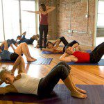 Hot New Fitness Systems Owe Much to Pilates Since 1995, Dynamic Fitness has focused on delivering the finest training in classical Pilates, the original body conditioning system developed by Joseph Pilates in 1926. Our studio's dedication to the classical method hasn't left much room in our class schedule for new fusion fitness systems, so you won't see us offering "yogalates" any time soon. Should we be worried that we're getting stodgy or set in our ways? We decided to investigate some of the hottest fitness systems out there today. What we discovered: Whether it's the actual exercises, fundamental techniques, or core concepts, these fitness fads borrow directly from classical Pilates. Check out these examples:Pure BarreCreated by dancer and choreographer Carrie Rezabek Dorr, Pure Barre delivers a low-impact workout designed to sculpt areas of the body that most women would identify as "problem spots," such as the stomach, buttocks, hips and arms. Before creating Pure Barre, Dorr trained in and taught Pilates; in Pure Barre, she sought a way to incorporate her favorite fitness systems into one workout. If you're experienced in Pilates, the mat warm-ups in a Pure Barre class will be almost second nature as you move through familiar exercises such as the hundred and the teaser. The Pure Barre abdominal "tuck," which pulls the hips forward in a posterior pelvic tilt, is not unlike the Pilates abdominal "scoop," particularly in its aim to neutralize the spine and prevent stress on the lower back. Pure Barre emphasizes isometric exercises at high reps -- this means moving through a very small range and holding muscular contractions in static positions. In contrast, a Pilates workout offers a full range of movement, including the more dynamic "concentric" and "eccentric" muscle contractions. While Pure Barre definitely incorporates the Pilates principles of concentration, control, and precision into each session, some critics say it's an incomplete workout. P90X®P90X® founder Tony Horton once admitted in an interview that he was "terrible" at Pilates. According to Horton, the original P90X® program "forced you to work on your weaknesses," so that's arguably why Pilates is now prominently featured as a standalone workout in Horton's newest P90X3® package. The "Pilates X" workout comprises 22 exercises from the classical Pilates mat routine, including stretches and instruction on breath control. The 30-minute routine includes moves suitable for beginners, such as the hundred, single leg stretch, and double leg stretch. But as you might expect from a P90X® workout, it's peppered with advanced exercises and challenging modifications in the open-leg rocker, teaser, shoulder bridge, and side kick series. Many people who subscribe to P90X® have never heard of Pilates, and complain that the instructions for breath control in Pilates X are confusing and nearly impossible to follow at first. We just recommend that you don't completely forget to breathe.[Source:  http://www.huffingtonpost.com/2013/09/12/tony-horton-p90x-yoga-breakfast_n_3902266.html]CrossFitTake  one step into "The Box" (otherwise known as a CrossFit gym), and you'll think there's no fitness system in the world more antithetical to Pilates. CrossFit's ultra-competitive approach is intended to push the body to its breaking point as you race against the clock and pile on weights. If you don't leave gasping and spent, you're not doing it right. What you may not see at first glance is that Pilates and CrossFit share origins in gymnastics. Both Joseph Pilates and CrossFit founder Greg Glassman were trained gymnasts. Both systems rely on integrated motion originating from "midline stability" in CrossFit, or your Pilates "powerhouse" -- whichever method you practice, you're constantly activating a strong core.  Glassman defines the exercises of CrossFit as "functional movements" that are "performed in a wave of contraction from core to extremity." Sound familiar? To us, this sounds just like the perfectly integrated motions of a Pilates workout that energetically radiate from the core. CrossFit does come with some drawbacks. Where Pilates helps students return the body to optimal function, CrossFit won't work for anyone who isn't already at this level. This effectively excludes people seeking an exercise regimen that can accommodate special needs due to injury or disability.  And if you're not already in good physical condition, the intense demands of CrossFit put you at considerable risk for hurting yourself. In our research, we have encountered several Pilates instructors and adept students who suggest Pilates can lay the foundation for someone to advance into a CrossFit regimen. On the flipside, CrossFit trainers often recommend a Pilates workout for an "active rest day." We've seen CrossFit gyms recruit Pilates experts to teach mat classes and help trainees apply Pilates principles to CrossFit. They confirm that Pilates training helps to reinforce flexibility, mobility, coordination and stability. These aspects of body conditioning are perhaps minimized in the regular CrossFit agenda, but without them, the CrossFit workout can be downright dangerous.  [Source: http://library.crossfit.com/free/pdf/what_is_crossfit.pdf]Have  you come across other fitness trends that remind you of Pilates? We'd love to discover more! Share your experiences with us on the Dynamic Fitness Facebook page: http://www.facebook.com/DynamicFitness